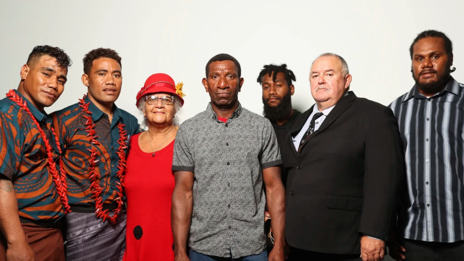 Seasonal workers Aleki and Talipope, missionary Jane Smith, worker Lazare Mankon, worker Moses, missionary Geoffrey Smith and worker Sergio, after they spoke at a Senate hearing about Pacific Island workers at Parliament House. Credit: Alex Ellinghausen