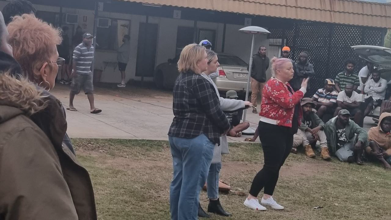 A Department of Foreign Affairs and Trade Office of the Pacific officer confronts frustrated South Sea Islander workers about their issues with the scheme at a Bundaberg motel on June 26, 2022. Credit: Courier Mail