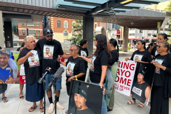 Jeremiah Rivers' loved ones held signs outside court. (ABC News: Alex Brewster)