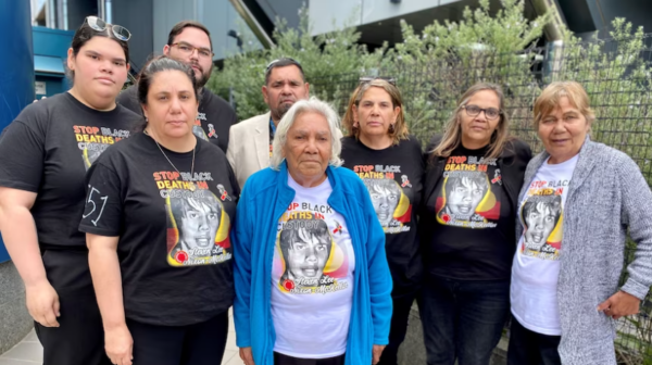 The Nixon-McKellar family have attended each day of the inquest wearing images of Steven. (ABC Southern Qld: Laura Cocks)