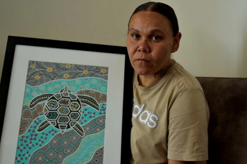 Cleveland Dodd’s mother, Nadene, with the last piece of artwork he produced in Unit 18.  (Jesinta Burton)