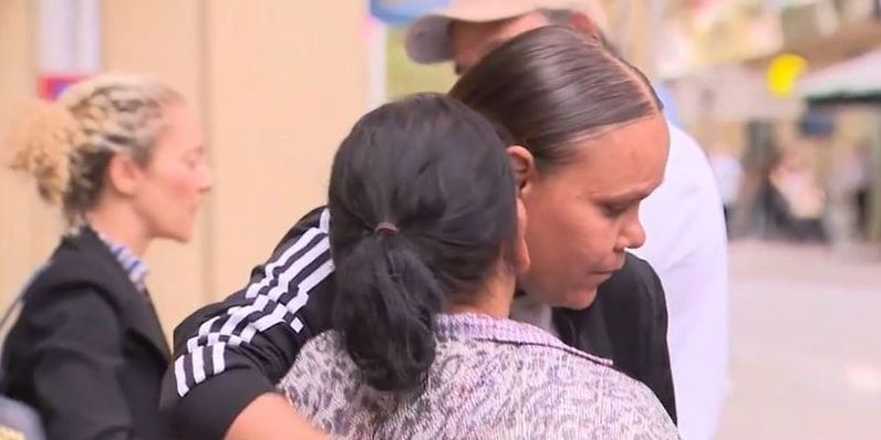 Cleveland Dodd's family outside of the inquest on Friday. Hearings into his death will now resume in July. (9News)