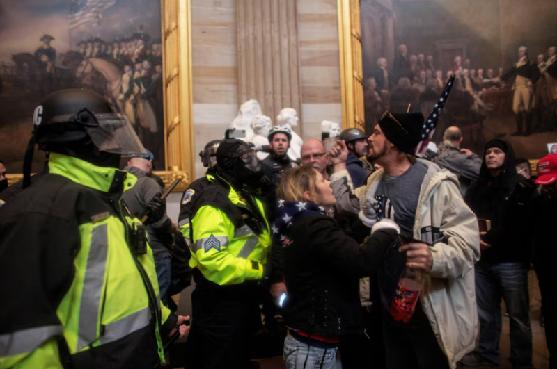 trump-supporters-storm-capitol The US version of the Thin Blue Line symbol was displayed by some Trump supporters who attacked the White House in January 2021. (Reuters)